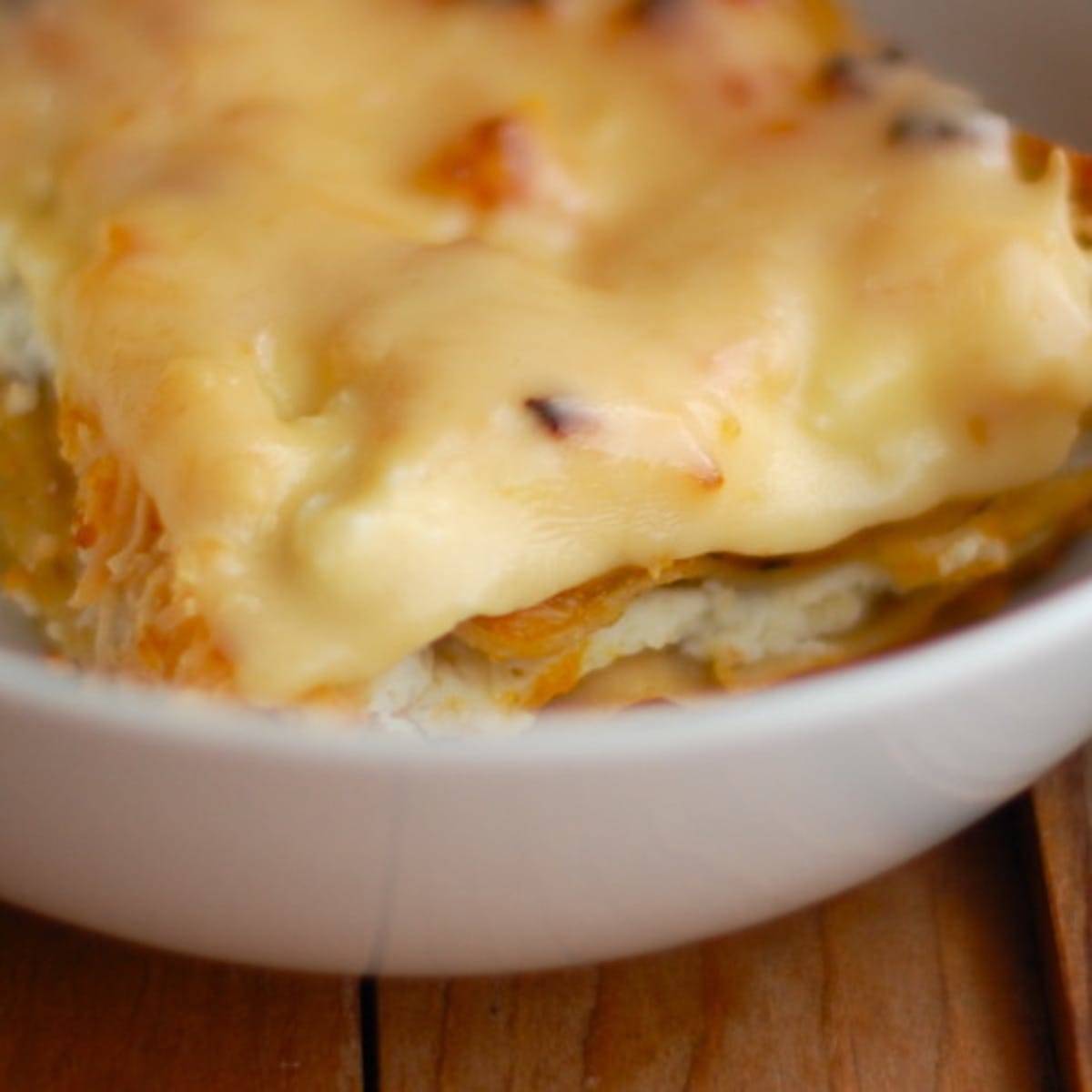 Butternut squash lasagna in a white bowl.