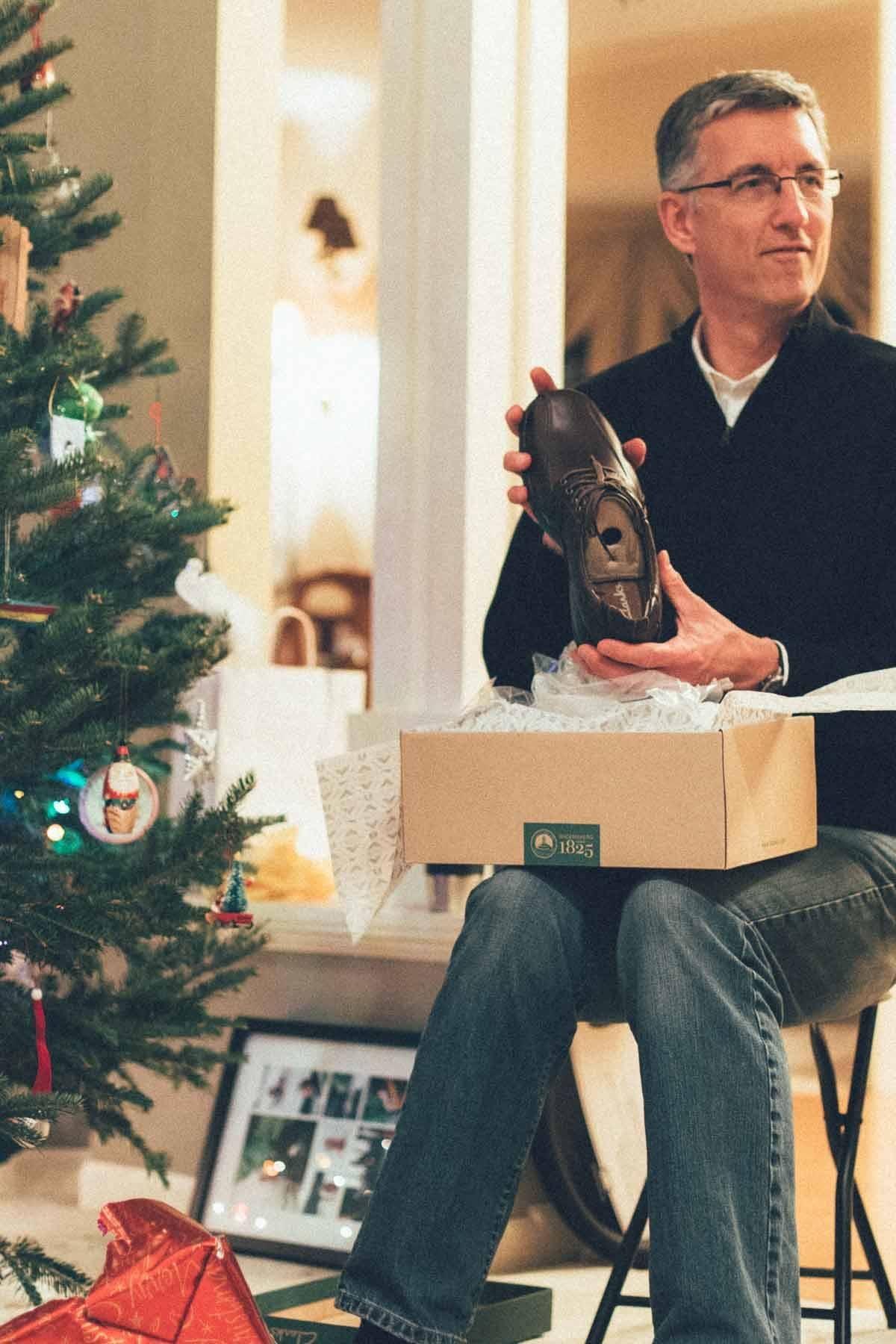Man holding a shoe.
